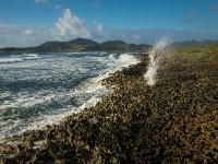 This is among the coral at the south end of Orient Beach.The blowhole is what I was trying to get a picture of. As the waves roll in the water rushes into a passage and shoots out this hole under pressure. On some days it shoots quite high!